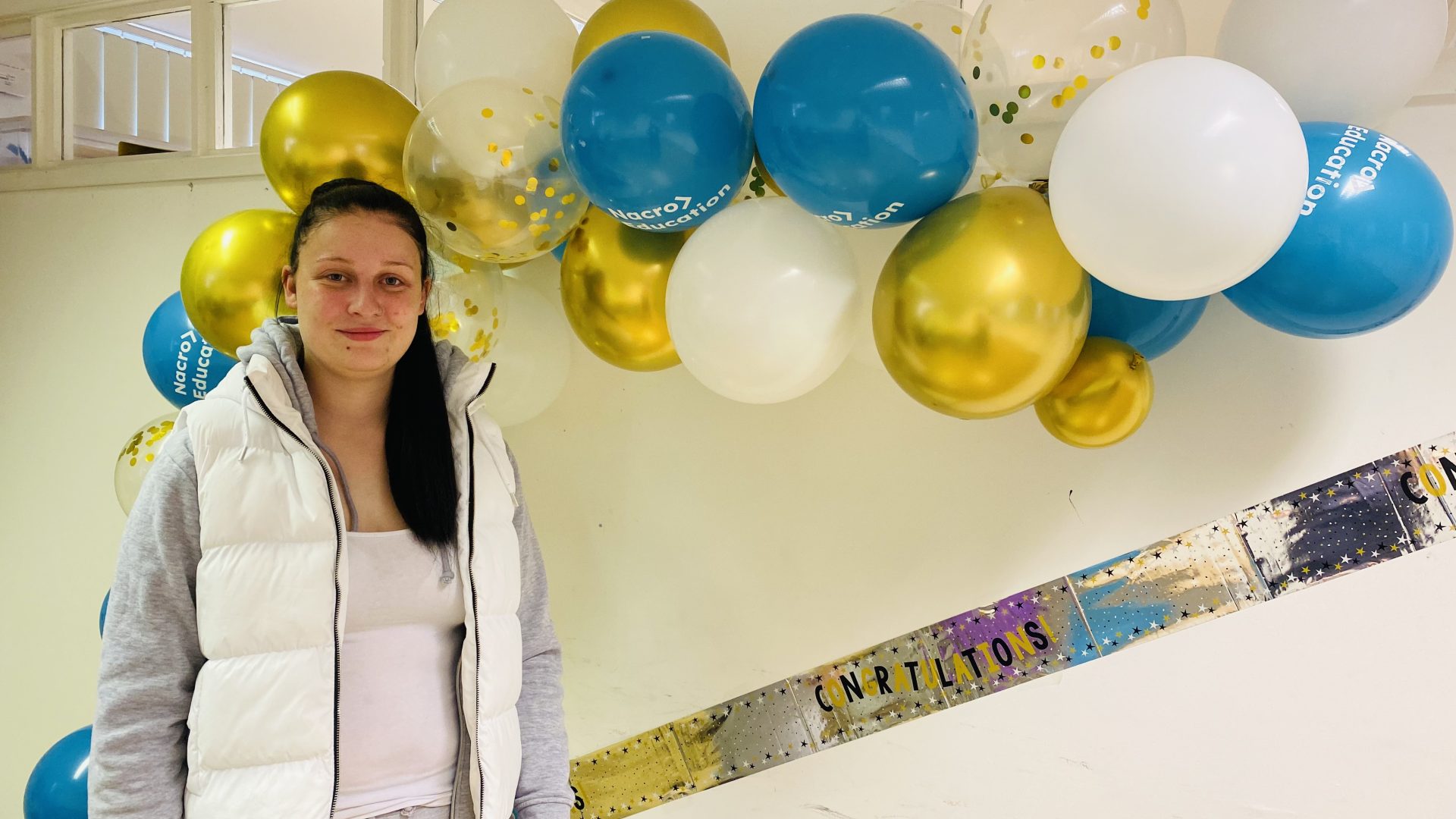 Learner at Nacro education celebrating GCSE results