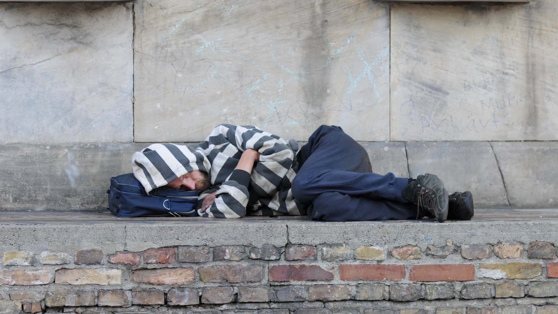 Homeless man sleeping outside