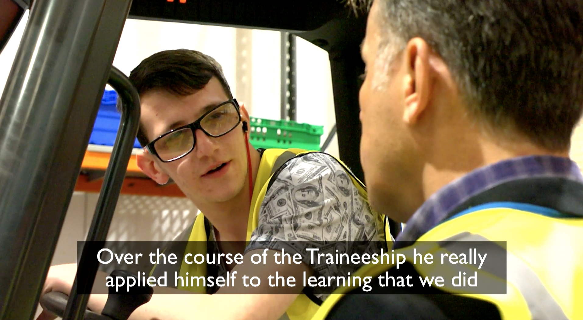 Person on a forklift talking to someone