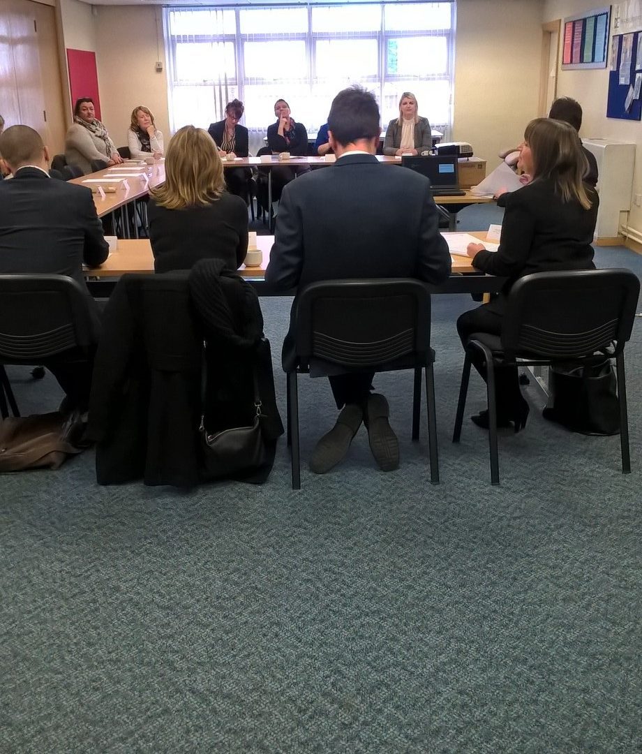 Group of people sitting in a meeting