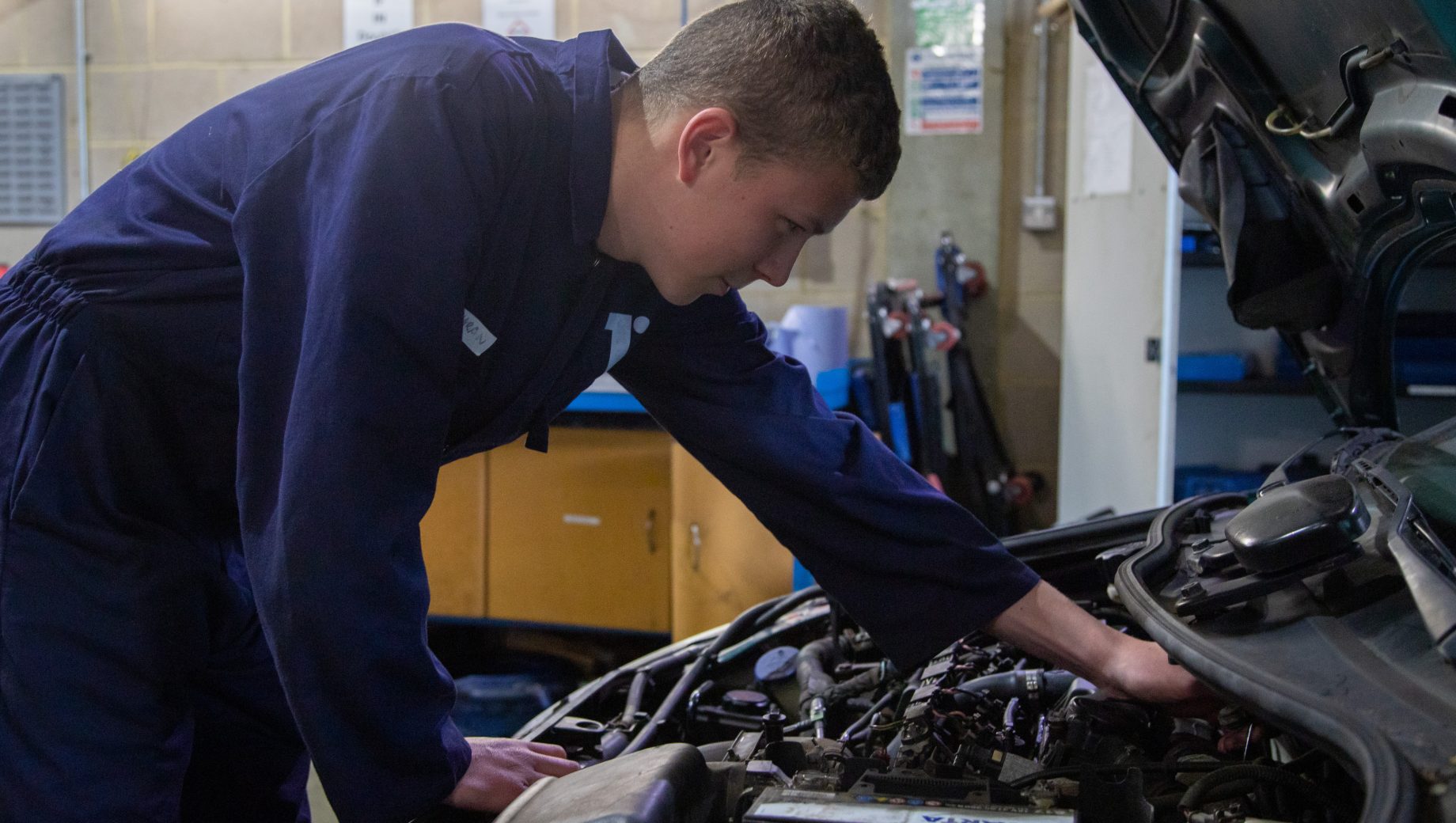 Mechanics student at Totton college working on a car