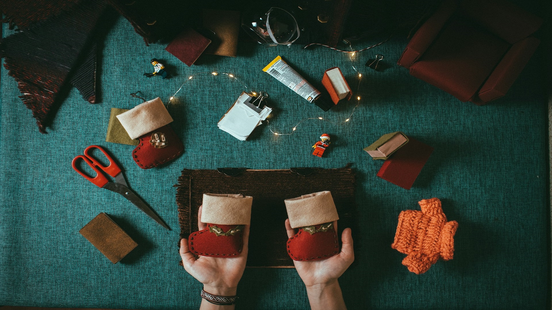 Image of hands holding home made Christmas decorations