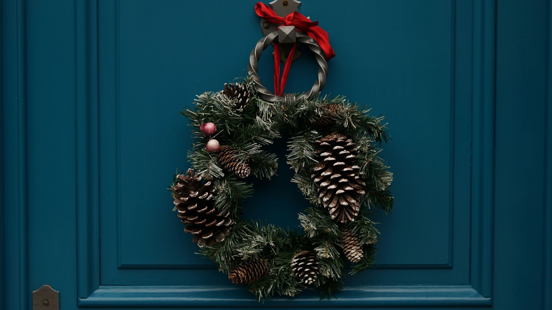 Image of a Christmas wreath hanging on a front door