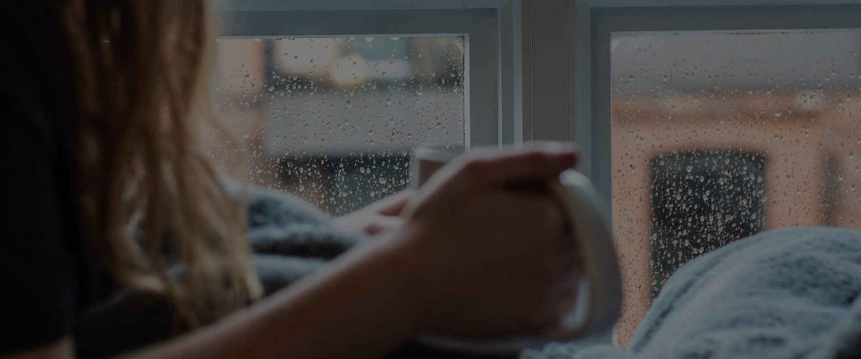 Person in supported housing looking out window